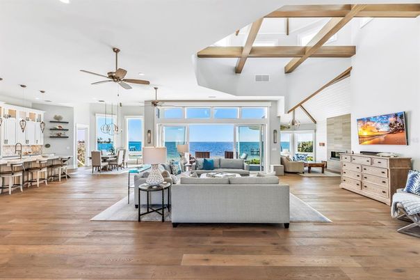 Dining room, Fireplace, Interior, Living room, Pendant Lights, Recessed Lighting, Water, Wooden Beams, Wood Texture Flooring