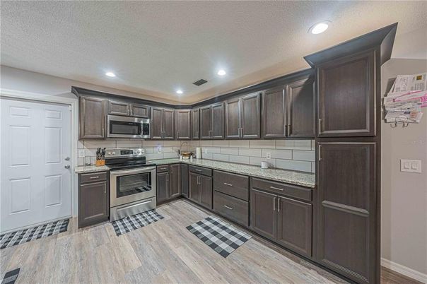 Interior, Kitchen, Recessed Lighting, Stainless Steel Appliances, Wood Texture Flooring