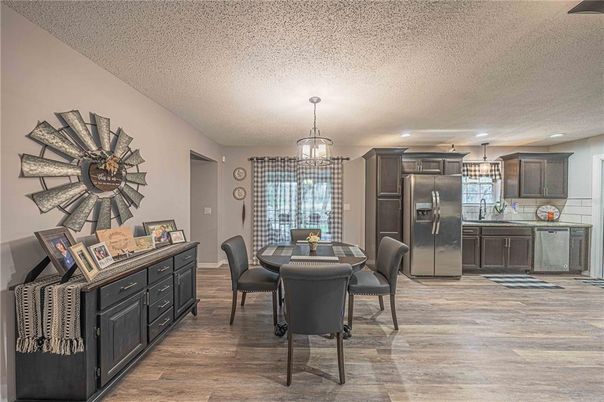 Chandelier, Dining room, Interior, Kitchen, Pendant Lights, Stainless Steel Appliances, Wood Texture Flooring