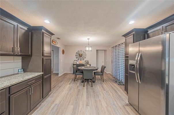 Dining room, Interior, Kitchen, Pendant Lights, Recessed Lighting, Stainless Steel Appliances, Wood Texture Flooring