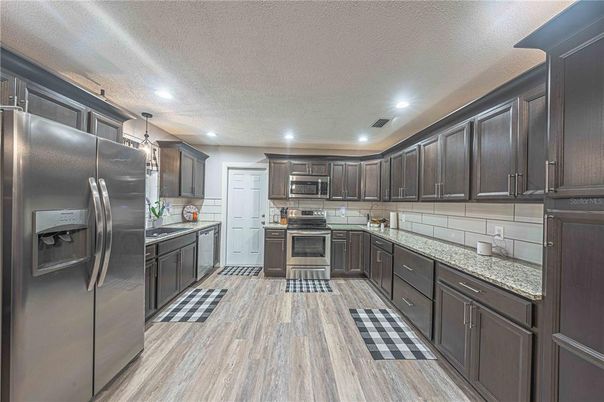 Interior, Kitchen, Pendant Lights, Recessed Lighting, Stainless Steel Appliances, Wood Texture Flooring