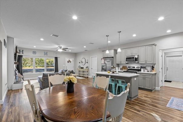 Dining room, Interior, Kitchen, Pendant Lights, Recessed Lighting, Stainless Steel Appliances, Wood Texture Flooring