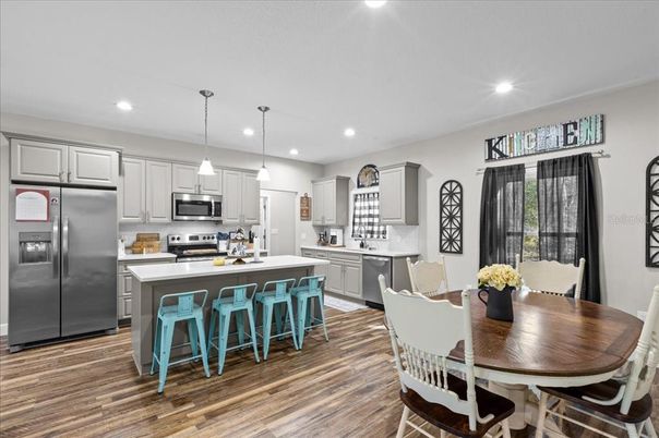 Dining room, Interior, Kitchen, Pendant Lights, Recessed Lighting, Stainless Steel Appliances, Wood Texture Flooring