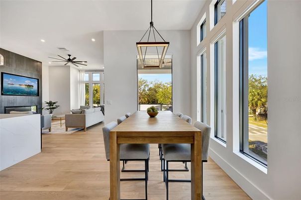 Dining room, Fireplace, Interior, Living room, Pendant Lights, Recessed Lighting, Wood Texture Flooring
