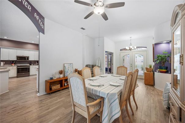 Chandelier, Dining room, Interior, Kitchen, Recessed Lighting, Stainless Steel Appliances, Wood Texture Flooring