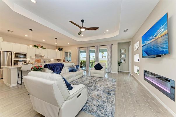 Fireplace, Interior, Kitchen, Living room, Pendant Lights, Recessed Lighting, Stainless Steel Appliances, Wood Texture Flooring
