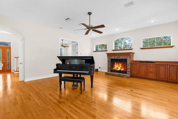 Fireplace, Interior, Piano, Recessed Lighting, Wood Texture Flooring