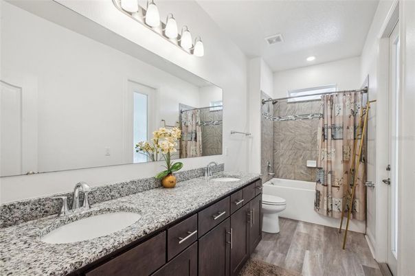 Bathroom, Dual Sink Vanities, Glass Shower, Interior, Recessed Lighting, Wood Texture Flooring