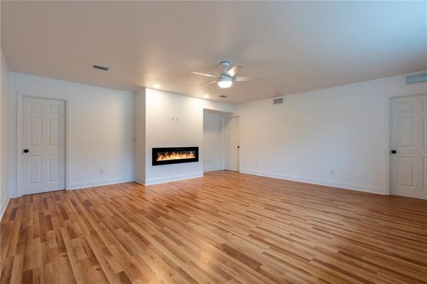Empty room, Fireplace, Interior, Recessed Lighting, Wood Texture Flooring