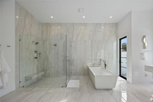 Bathroom, Free Standing Baths, Glass Shower, Interior, Marble, Marble Walls, Recessed Lighting