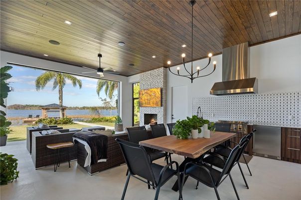 Dining room, Fireplace, Interior, Living room, Recessed Lighting, Water, Wooden Ceilings