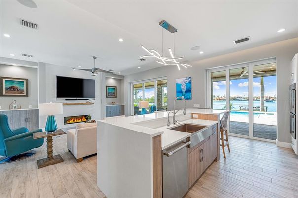 Fireplace, Interior, Kitchen, Living room, Pendant Lights, Recessed Lighting, Water, Wood Texture Flooring