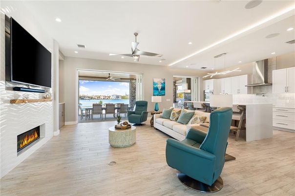 Dining room, Fireplace, Interior, Kitchen, Living room, Pendant Lights, Recessed Lighting, Water, Wood Texture Flooring