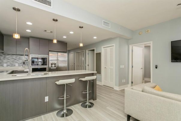 Interior, Kitchen, Pendant Lights, Recessed Lighting, Stainless Steel Appliances, Wood Texture Flooring