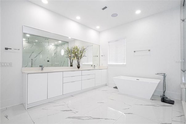 Bathroom, Dual Sink Vanities, Free Standing Baths, Glass Shower, Interior, Marble, Marble Walls, Recessed Lighting