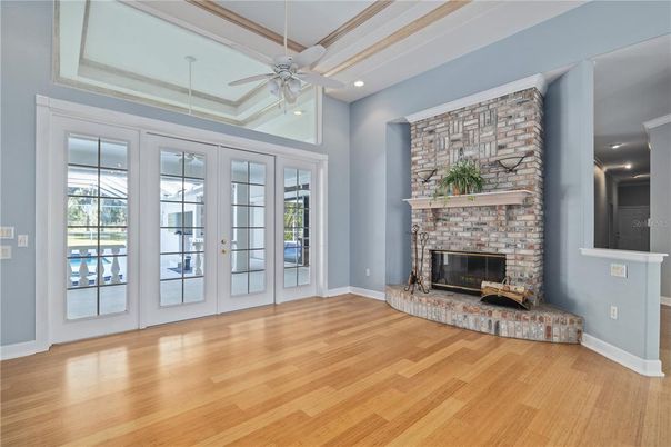 Empty room, Fireplace, Interior, Recessed Lighting, Stone Walls, Wood Texture Flooring