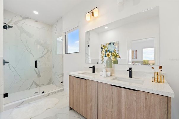 Bathroom, Dual Sink Vanities, Glass Shower, Interior, Marble, Marble Walls, Recessed Lighting