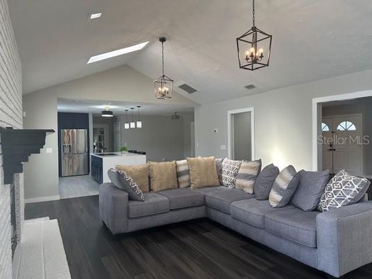 Fireplace, Interior, Kitchen, Living room, Pendant Lights, Stainless Steel Appliances, Wood Texture Flooring