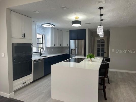 Interior, Kitchen, Pendant Lights, Stainless Steel Appliances, Wood Texture Flooring
