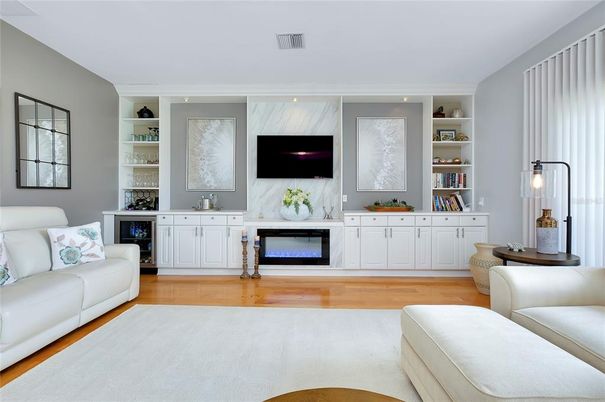 Fireplace, Interior, Living room, Marble Walls, Recessed Lighting, Wood Texture Flooring