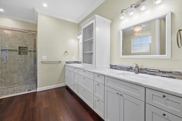 Bathroom, Dual Sink Vanities, Glass Shower, Interior, Recessed Lighting, Wood Texture Flooring