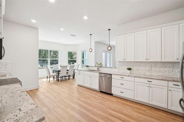 Dining room, Interior, Kitchen, Pendant Lights, Recessed Lighting, Stainless Steel Appliances, Wood Texture Flooring