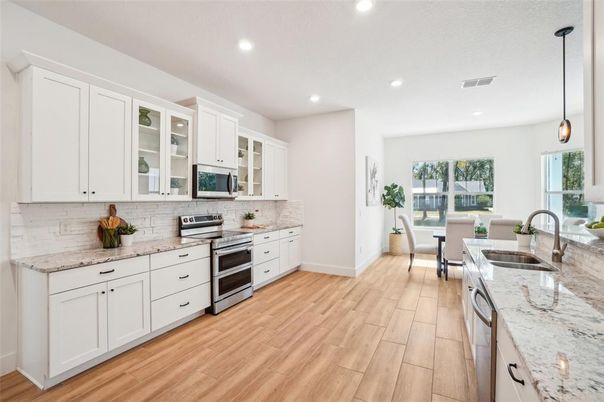 Dining room, Interior, Kitchen, Pendant Lights, Recessed Lighting, Stainless Steel Appliances, Wood Texture Flooring