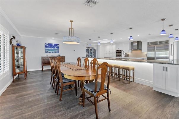 Dining room, Interior, Kitchen, Pendant Lights, Recessed Lighting, Stainless Steel Appliances, Wood Texture Flooring