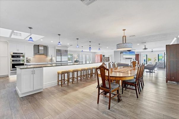 Dining room, Interior, Kitchen, Pendant Lights, Recessed Lighting, Stainless Steel Appliances, Wood Texture Flooring