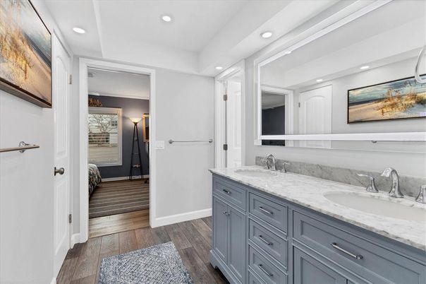 Bathroom, Dual Sink Vanities, Interior, Recessed Lighting, Wood Texture Flooring