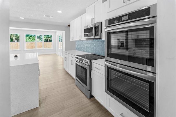 Interior, Kitchen, Recessed Lighting, Stainless Steel Appliances, Wood Texture Flooring