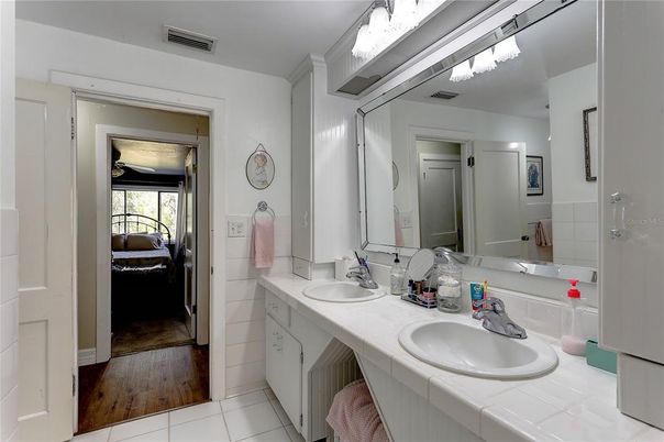 Bathroom, Dual Sink Vanities, Interior, Tile Countertops, Wood Texture Flooring