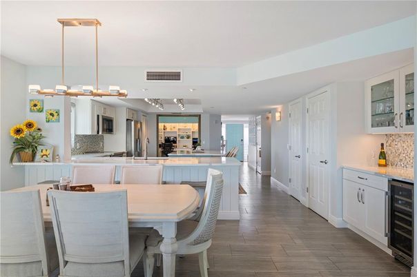 Dining room, Interior, Kitchen, Pendant Lights, Recessed Lighting, Stainless Steel Appliances, Wood Texture Flooring