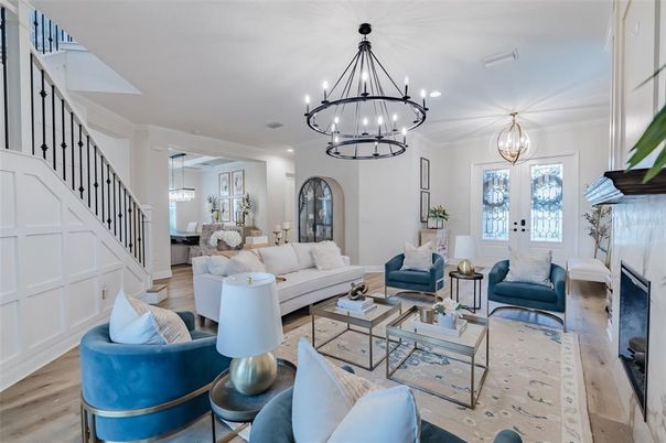 Chandelier, Dining room, Fireplace, Interior, Living room, Pendant Lights, Recessed Lighting, Wood Texture Flooring