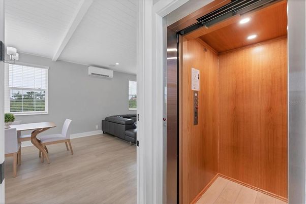 Dining room, Elevator, Interior, Recessed Lighting, Wooden Ceilings, Wood Texture Flooring, Wooden Walls