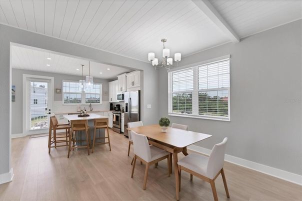 Chandelier, Dining room, Interior, Kitchen, Pendant Lights, Recessed Lighting, Stainless Steel Appliances, Wood Texture Flooring