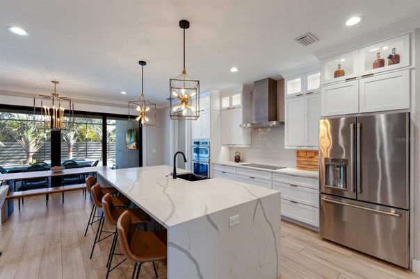 Dining room, Interior, Kitchen, Pendant Lights, Recessed Lighting, Stainless Steel Appliances, Wood Texture Flooring