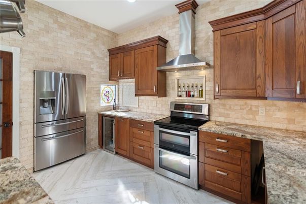 Interior, Kitchen, Recessed Lighting, Stainless Steel Appliances, Stone Walls, Wood Texture Flooring