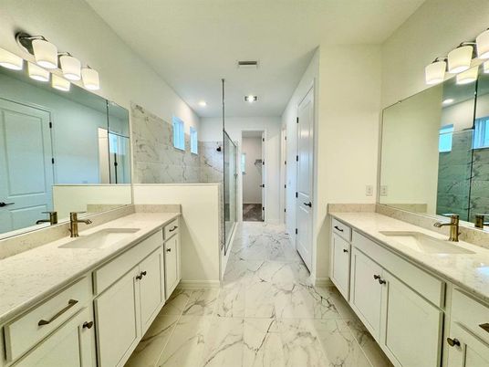 Bathroom, Dual Sink Vanities, Glass Shower, Interior, Marble, Marble Walls, Recessed Lighting