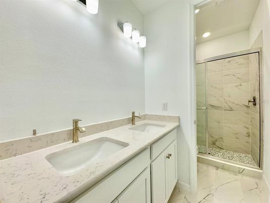 Bathroom, Dual Sink Vanities, Glass Shower, Interior, Marble, Marble Walls, Recessed Lighting