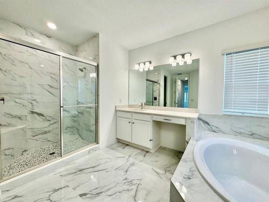 Bathroom, Dual Sink Vanities, Glass Shower, Interior, Marble, Marble Walls, Recessed Lighting