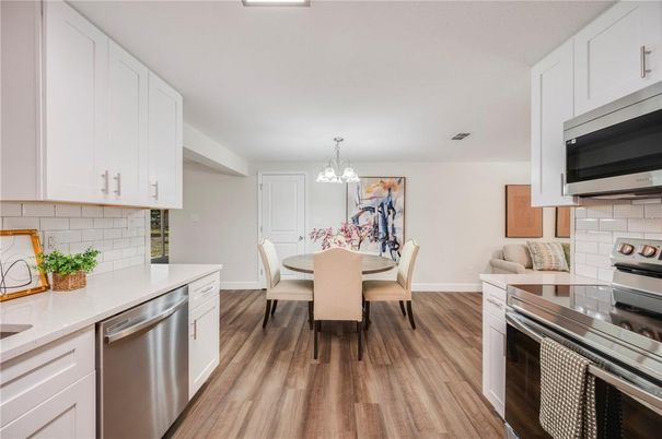 Chandelier, Dining room, Interior, Kitchen, Stainless Steel Appliances, Wood Texture Flooring