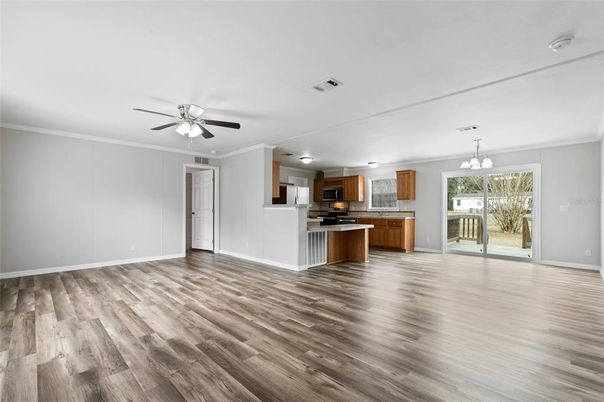 Empty room, Interior, Kitchen, Pendant Lights, Stainless Steel Appliances, Wood Texture Flooring