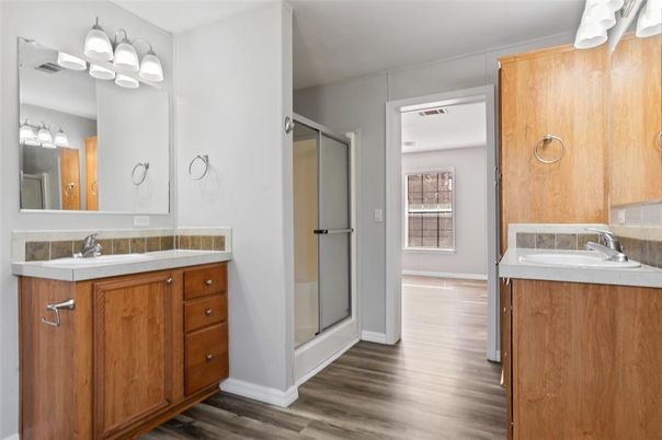 Bathroom, Dual Sink Vanities, Glass Shower, Interior, Wood Texture Flooring