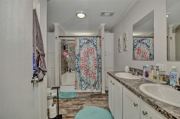 Bathroom, Dual Sink Vanities, Glass Shower, Interior, Wood Texture Flooring
