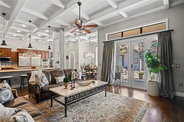 Chandelier, Dining room, Interior, Kitchen, Living room, Pendant Lights, Recessed Lighting, Stainless Steel Appliances, Wood Texture Flooring