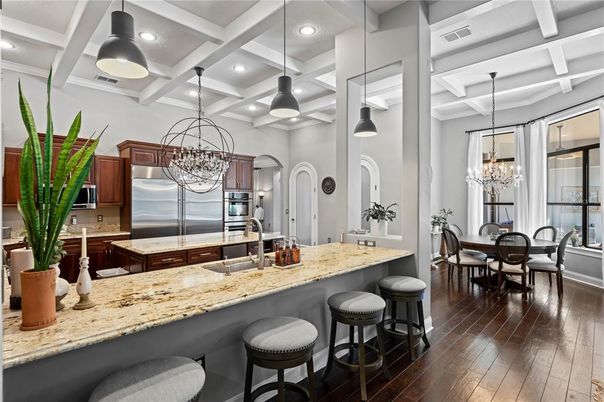 Chandelier, Dining room, Interior, Kitchen, Pendant Lights, Recessed Lighting, Stainless Steel Appliances, Wood Texture Flooring