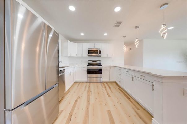 Interior, Kitchen, Pendant Lights, Recessed Lighting, Stainless Steel Appliances, Wood Texture Flooring