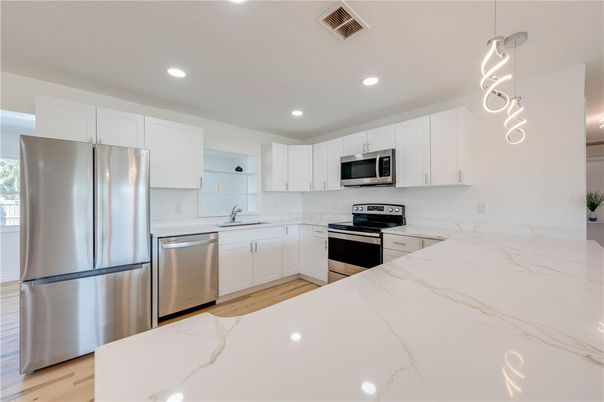 Interior, Kitchen, Pendant Lights, Recessed Lighting, Stainless Steel Appliances, Wood Texture Flooring