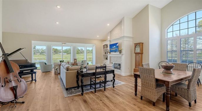 Dining room, Fireplace, Interior, Living room, Piano, Recessed Lighting, Wood Texture Flooring